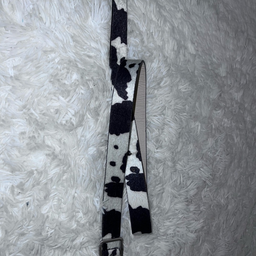Thrifted boutique belt. Cow print.